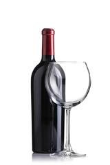 red wine bottle and an empty glass