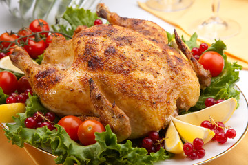 Whole roasted chicken on table