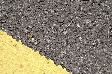 Asphalt texture with yellow corner