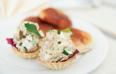 Appetizer in tartlets and patties on plate