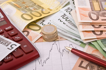 Money, pen and calculator