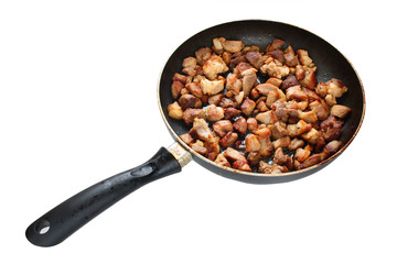 pork meat fried on the pan isolated over white