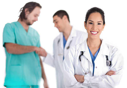 young doctor smiling, other doctor giving shakehand to nurse