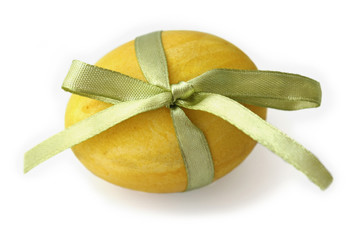 Yellow Easter Egg tied with a ribbon
