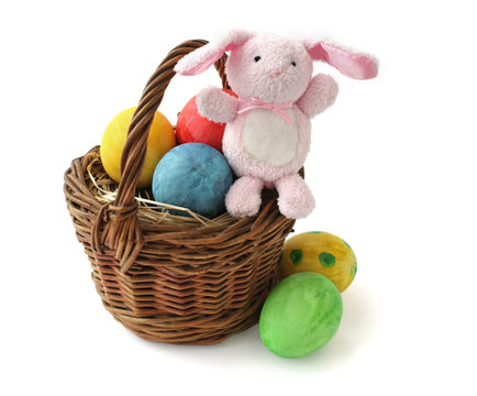 Painted Easter eggs and a rabbit in a basket