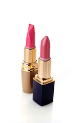Fototapeta premium Two new lipsticks on the white background