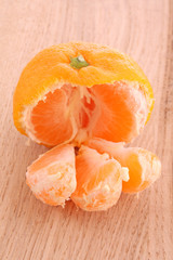 Fresh mandarin isolated on wooden background