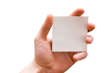 The hand holds a white sheet of paper, is isolated