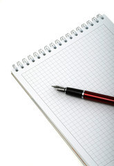 Pen and notebook for notes on a white background. Isolated