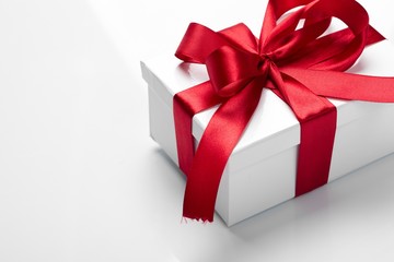 Gift decorated with a tape and a bow