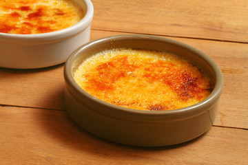 Creme brulee on wooden board