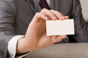 Blank business card in a hand