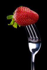 Strawberry on the fork.
