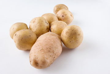 Potatoes raw over white background