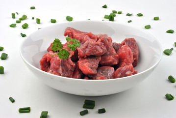 fresh beef lean diced steak in a bowl