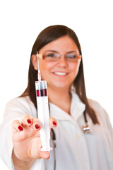 female doctor with glasses holding a syringe in her hand