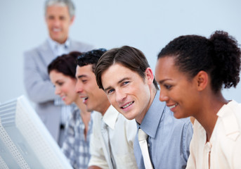 Fototapeta premium Young business people at work with their manager