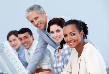 Charismatic mature manager checking his employee's work