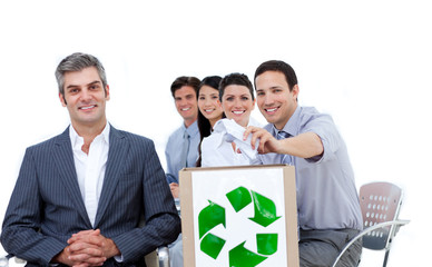 Confident business people showing the concept of recycling