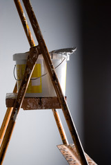 Paint bucket at stepladder over extreme back light