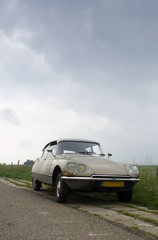 Fototapeta premium Vintage car on Dutch Dyke