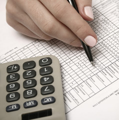 Stock chart with calculator, pen.