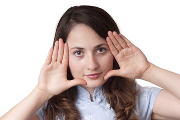 Fototapeta premium Young woman with still gesture (finger on lips) isolated