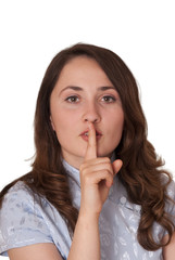 Naklejka premium Young woman with still gesture (finger on lips) isolated