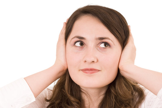 Woman plugging her ears over white background