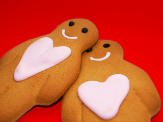 Gingerbread people against red background