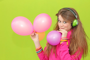 Fototapeta na wymiar teen blowing birthday party balloons