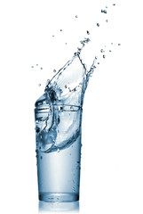 water splash in glass isolated on white