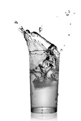 water splash in glass isolated on white