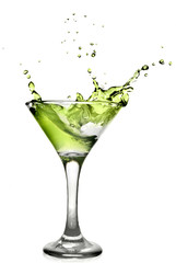 Green alcohol cocktail with splash isolated on white
