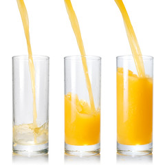 Pouring orange juice into the glass isolated on white