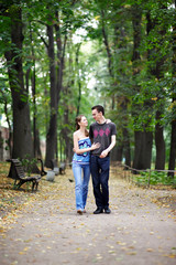 Man and woman on a walk in park