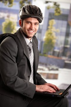 Businessman wearing bike helmet