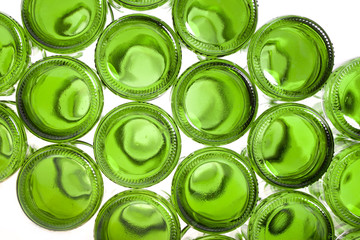 Bottoms of empty glass bottles on white background