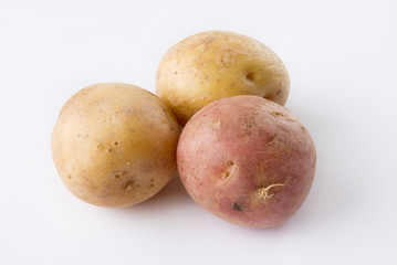 Three potatoes isolated on a white background