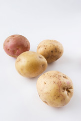 Potatoes raw over white background
