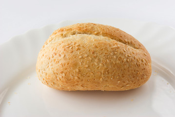 One Empty bun on a white plate
