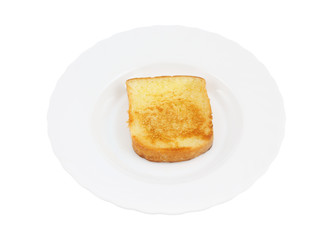 One toast on white plate isolated