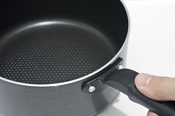 hand holding pan