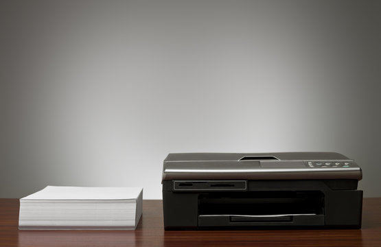 Copy Machine and a pile of papers