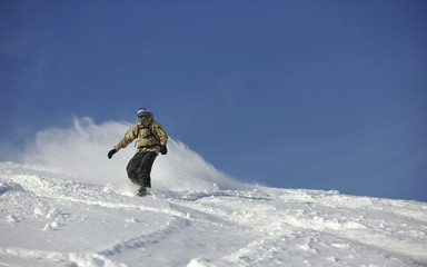 freestyle snowboarder jump and ride
