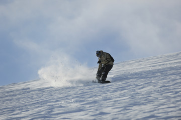 freestyle snowboarder jump and ride