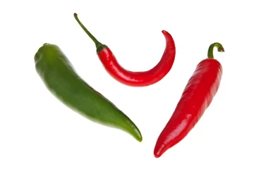 Fotobehang Red and green spicy peppers isolated over white background. © Bart
