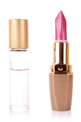New lipstick and some liquid cosmetics isolated on white