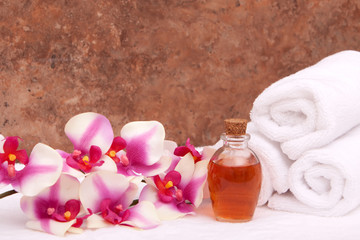 Aromatherapy oils, orchid and towels