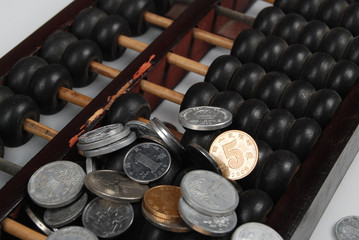 an abacus and coins